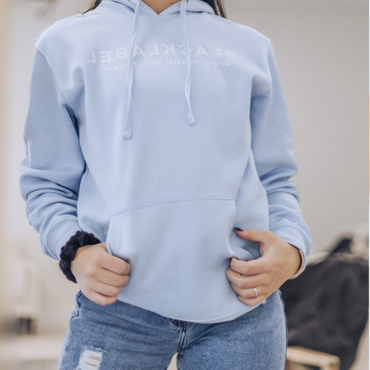 Light blue Blacklabel Supplements hoodie worn by model.