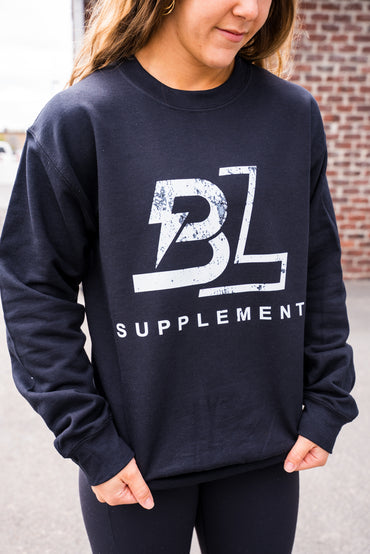 Person wearing a navy blue sweatshirt with 'BL Supplement' logo.