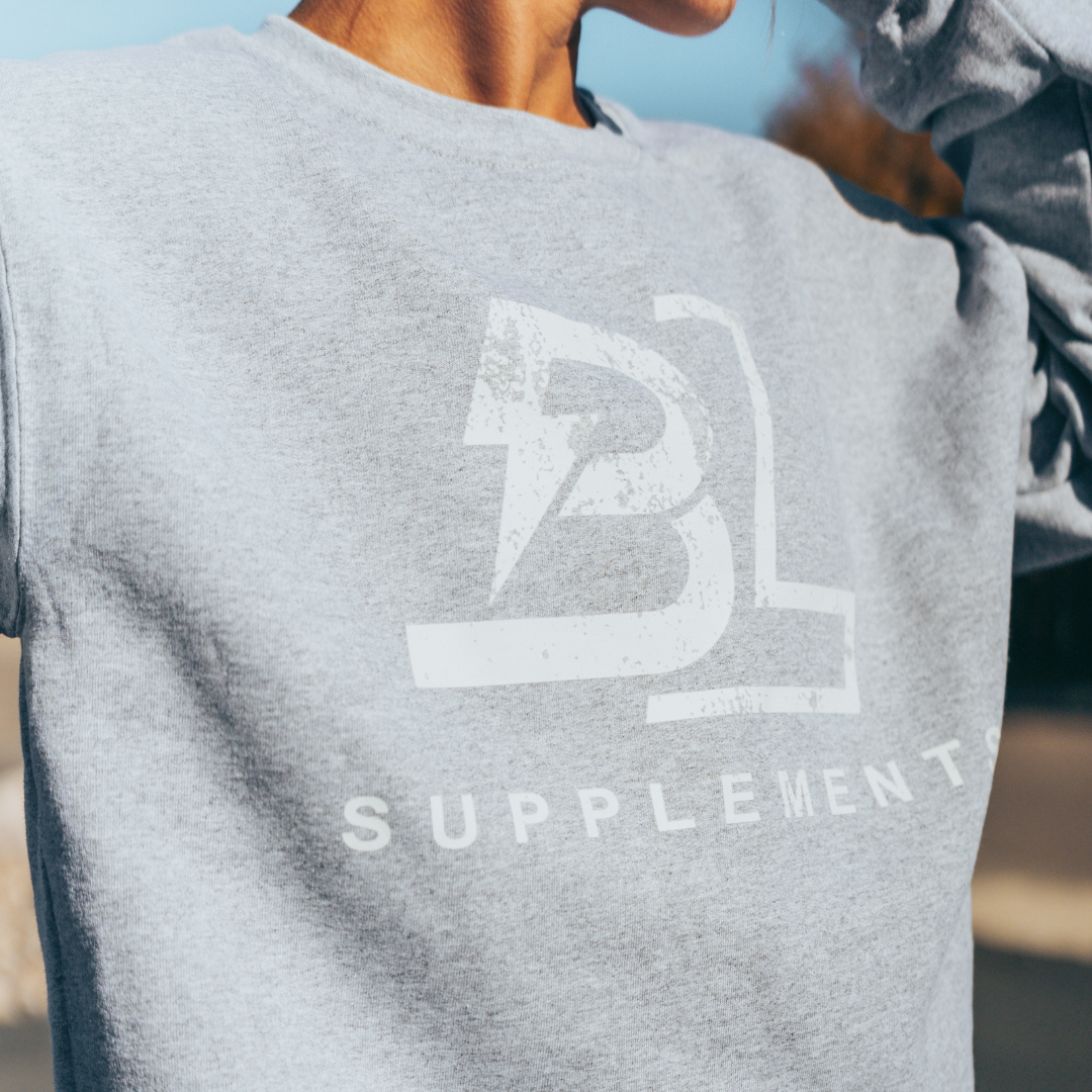 model wearing Gray Blacklabel Supplements crewneck sweatshirt with BL logo.